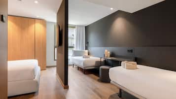 Family Quadruple Room | Minibar, in-room safe, desk, laptop workspace