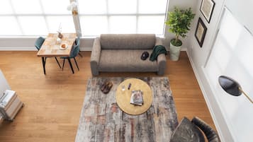 Loft panorâmico, 2 quartos | Área de estar | Smart TV 65 polegadas com canais digitais