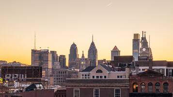 A city skyline with historic buildings and modern skyscrapers.