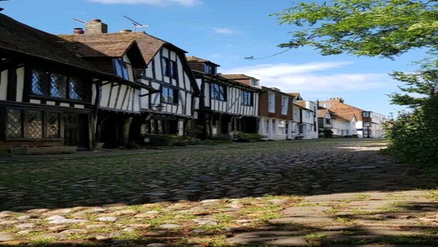 A cobblestone street lined with traditional half-timbered houses. - Nollaig  Beachside Bliss - Pass the Keys (Rye)