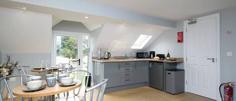 Fridge, microwave, toaster, cookware/dishes/utensils