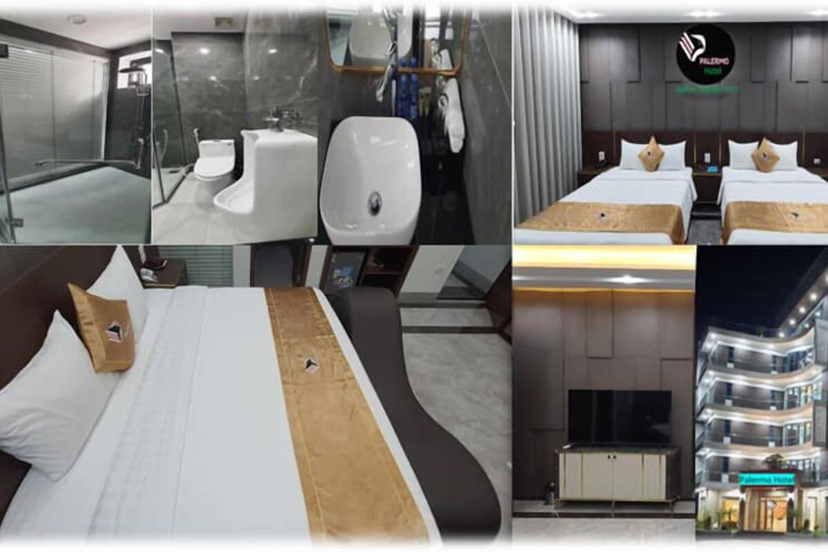A hotel room with a modern bathroom, a bed with a unique headboard, and a view of the hotel exterior.