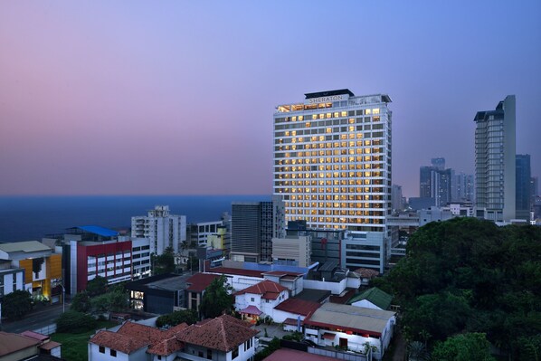 A high-rise hotel with multiple floors and a prominent sign at the top.