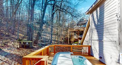 Tranquil lake retreat with private hot tub, fire pit, deck, & incredible views