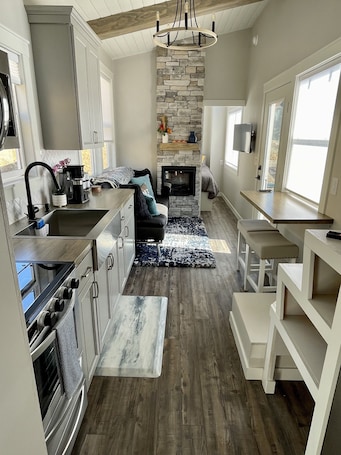 Private kitchen. Delightful Tiny Home w/ indoor Fire Place