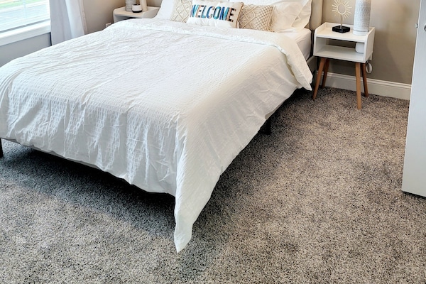 2nd Queen Bedroom, with walk-in closet, private 55" smart tv, and full ensuite