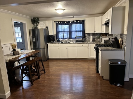 Fridge, microwave, oven, stovetop. Cozy Three bedroom home in Central Farmington