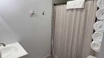 Hair dryer, towels, soap, shampoo