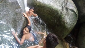 A natural water feature with rocks and a stream. - La Cima Tayrona (Santa Marta)