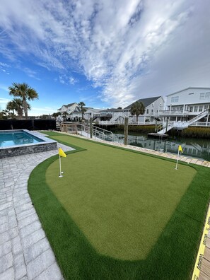 Property grounds - New Pool + Putting Green, Walk to Beach, Waterfront Home in Cherry Grove! (North Myrtle Beach)