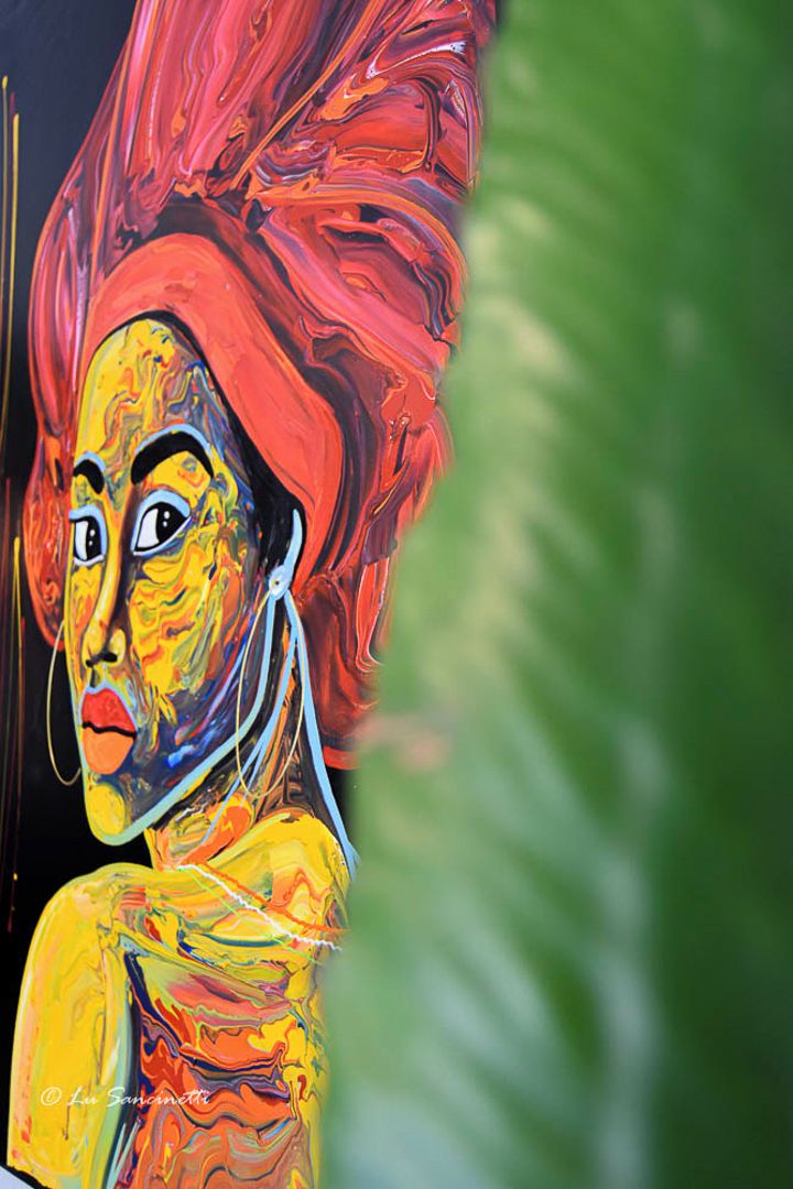 A painting with abstract human figures and vibrant colors.