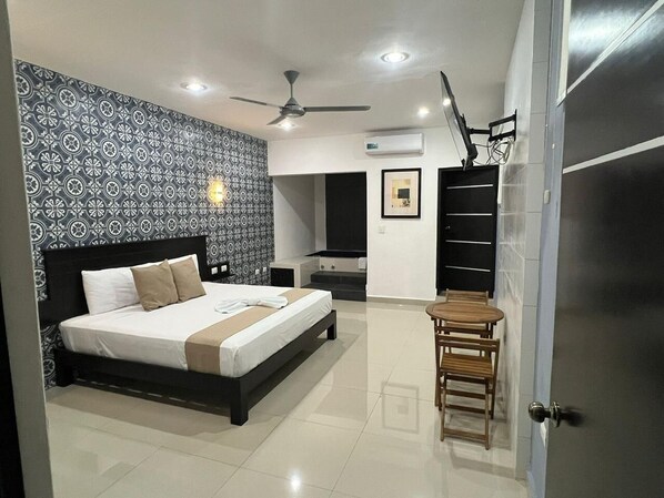 Room, 1 King Bed, Non Smoking, Hot Tub | In-room safe, laptop workspace, free WiFi, bed sheets