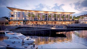 Enjoy waterfront views from the hotel's spacious outdoor area with seating.