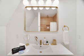 Hair dryer, towels, soap, shampoo