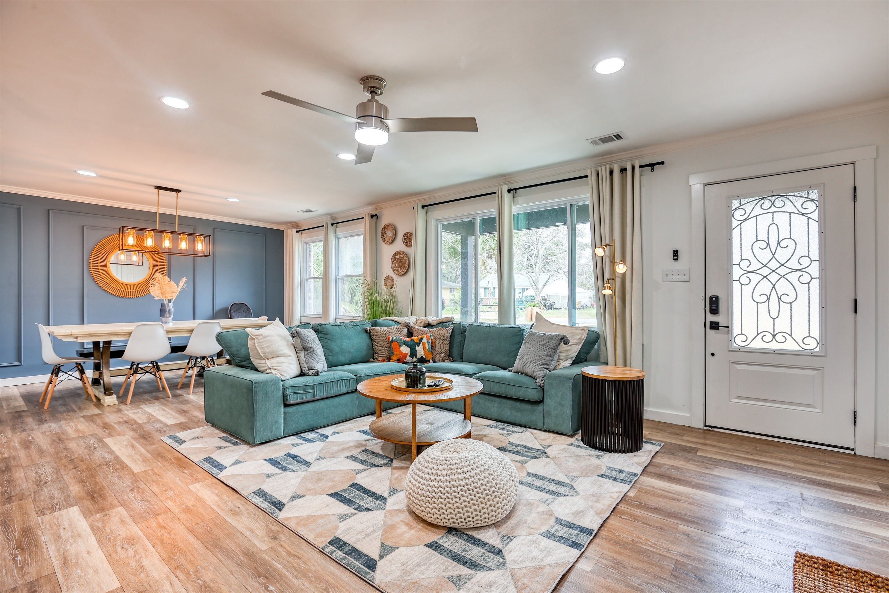 View of the expansive living area showing the smooth transition from lounging to dining, perfect for gatherings and family time.