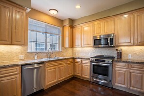 Fridge, microwave, oven, stovetop - Trendy Fremont 3BR w/ Garage & Balcony, nr Park + Trail, by Blueground (South Bay)