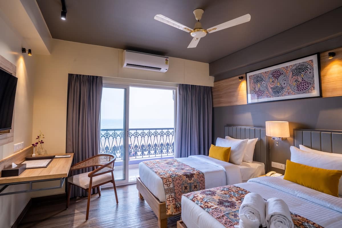 Deluxe Twin Room, Balcony, Partial Sea View | In-room safe, laptop workspace, iron/ironing board (on request)