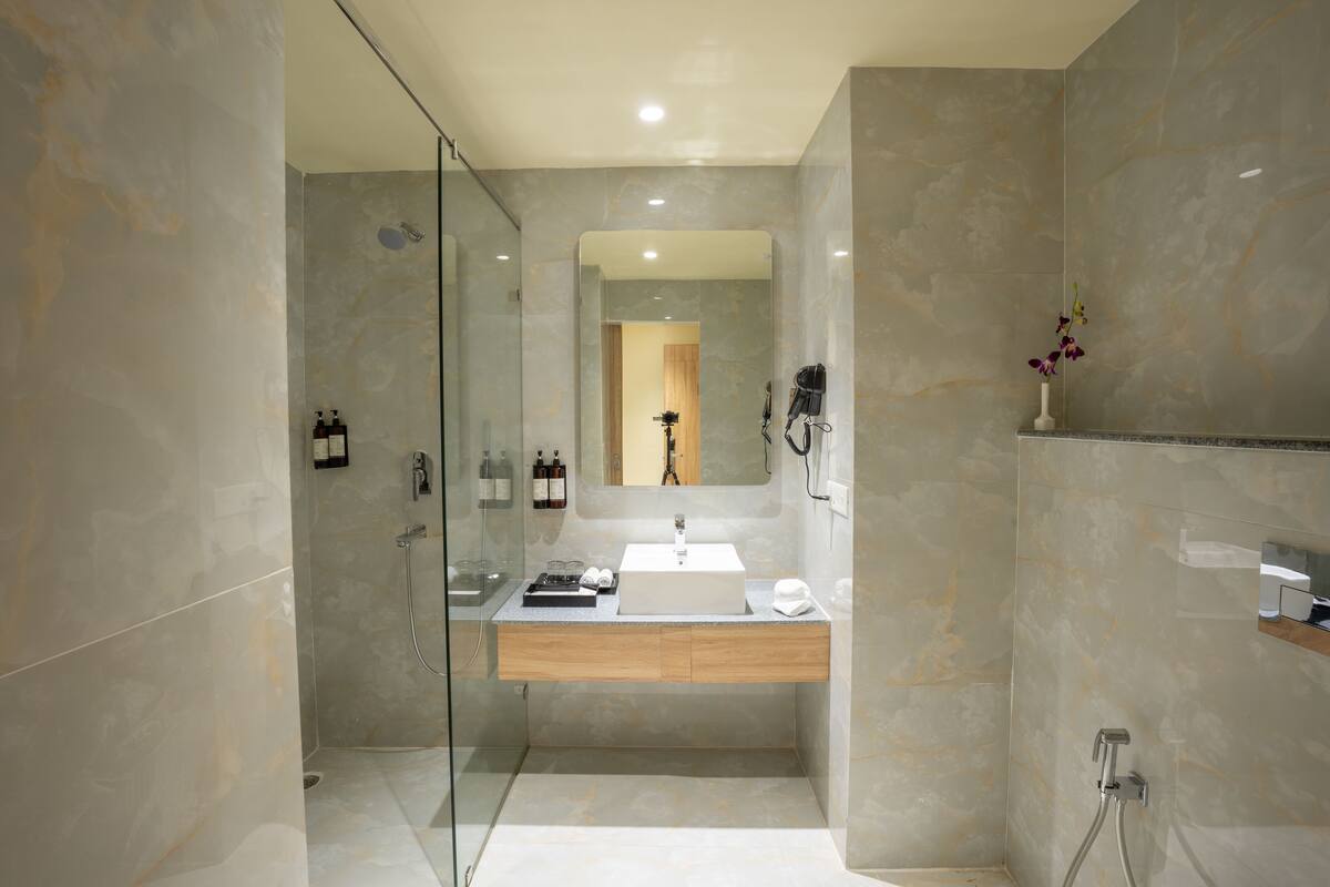 Shower, rainfall showerhead, hair dryer, towels