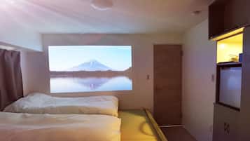 Enjoy a serene retreat with a single bed, flat-screen TV, and kitchenette area.
