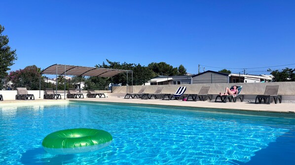 Seasonal outdoor pool, pool loungers