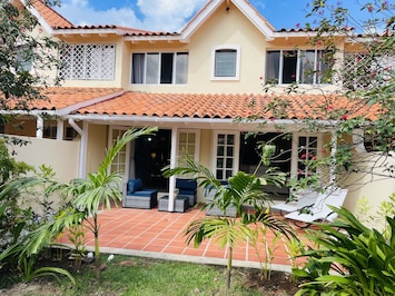 Rear of the property with a peaceful private patio.