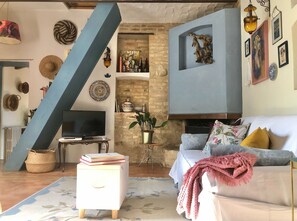 Smart TV, fireplace, books