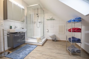 Shower, hair dryer, towels, soap