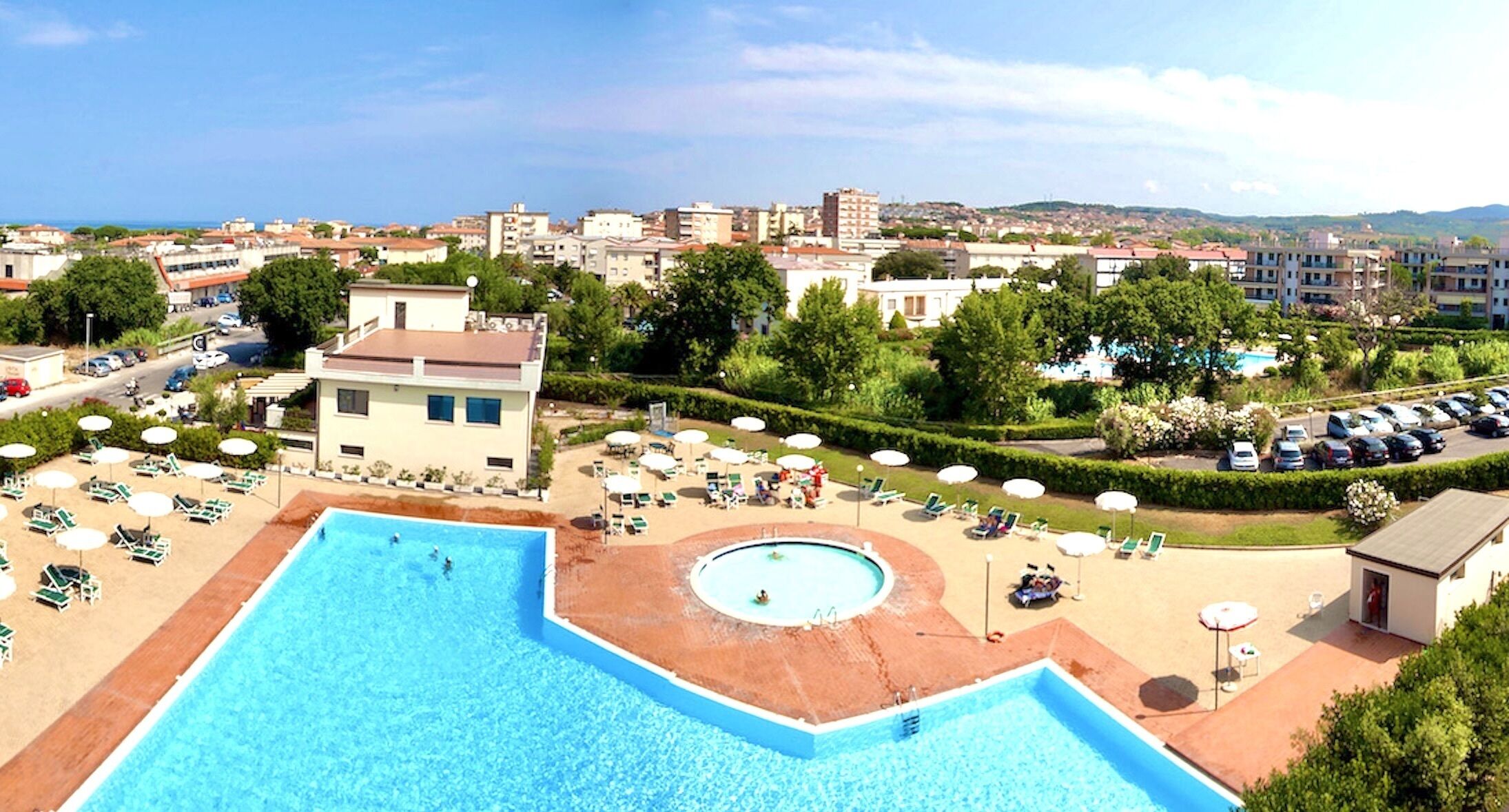 Seasonal outdoor pool, pool umbrellas, pool loungers