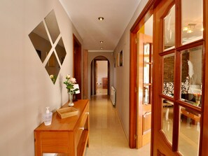 Guests can enjoy a thoughtful welcome with a vase of flowers and hand sanitizer at their disposal.