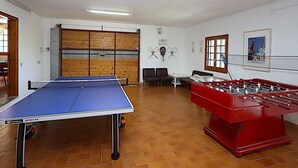 A room with a foosball table, a ping pong table, and a billiards table. - 6-Bedroom Villa with Private Pool in Lloret de Mar (Lloret de Mar)
