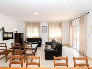 TV, fireplace - Seaside Villa for 17: Private Pool, BBQ, 7 Bedrooms, Near Cala Canyelles (Lloret de Mar)