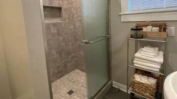 Shower, hair dryer, towels, soap