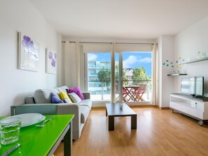 TV - Charming Family Apartment in Santa Margarita: Pool, Parking, Near Beach and Shops (Roses)