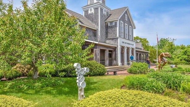 A historic building with a prominent tower and a sign reading "Cafe Museum of Art". - Sunroom, Spacious Deck, 8 Mins to Mayflower Beach! (Dennis)