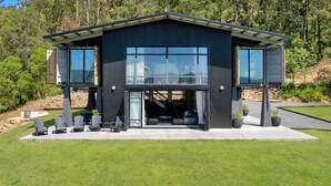A modern two-story building with large windows and a covered outdoor seating area. - Sky Ridge, Kangaroo Valley (Kangaroo Valley)