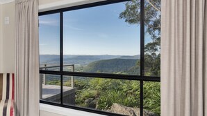 A room with a large window offering a view of a mountainous landscape. - Valley View Estate, Kangaroo Valley (Beaumont, Kangaroo Valley)