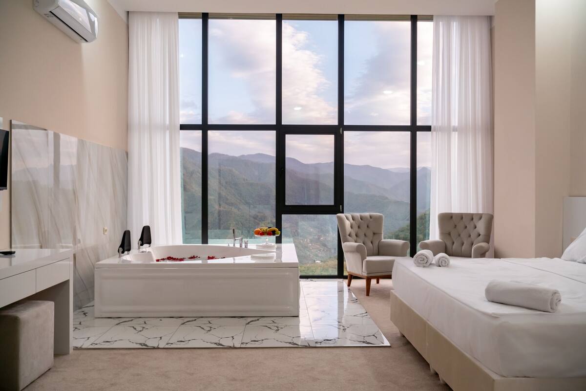 Royal Suite | Frette Italian sheets, premium bedding, Select Comfort beds, desk