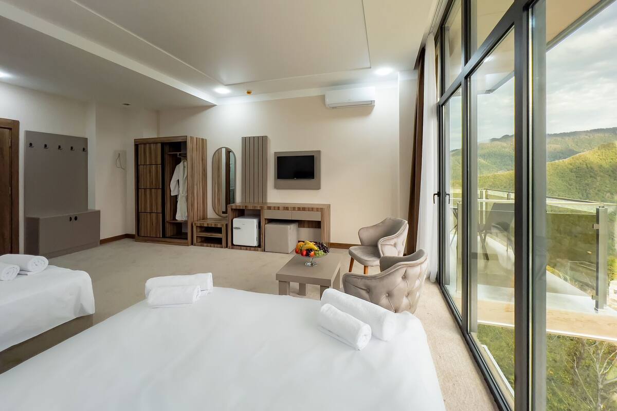 Family Room | Frette Italian sheets, premium bedding, Select Comfort beds, desk