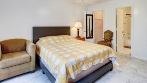 A bedroom with a bed, a chair, a ceiling fan, a lamp, and a mirror. - Peaceful Savannah Home - 11 Mi to Beaches! (Savannah)