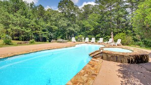 A swimming pool with lounge chairs and a hot tub, surrounded by trees. - Kingston Home w/ Shared Pool - 23 Mi to Lakepoint! (Kingston)