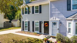 A two-story house with a front porch, a mailbox, and a wreath on the door. - North Macon Townhome w/ Deck < 8 Mi to Downtown! (Macon)