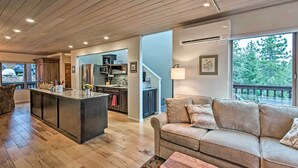 A spacious living area with a large island, a sofa, and a view of the outdoors. - 2 Mi to Heavenly Mountain: Tahoe Retreat w/ Views (Zephyr Cove)