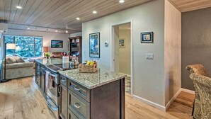 A modern kitchen with granite countertops, stainless steel appliances, and wooden cabinetry. - 2 Mi to Heavenly Mountain: Tahoe Retreat w/ Views (Zephyr Cove)