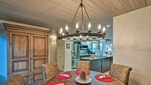A dining area with a round table set for six, featuring red placemats and a pine cone centerpiece. - 2 Mi to Heavenly Mountain: Tahoe Retreat w/ Views (Zephyr Cove)