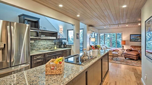 A modern kitchen with a stainless steel refrigerator, granite countertops, and a built-in microwave. - 2 Mi to Heavenly Mountain: Tahoe Retreat w/ Views (Zephyr Cove)