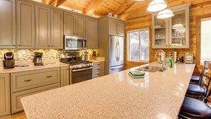 A kitchen with granite countertops, stainless steel appliances, and wooden cabinets. - 4 Mi to Beach: Lake Tahoe Mountain Retreat! (Stateline)