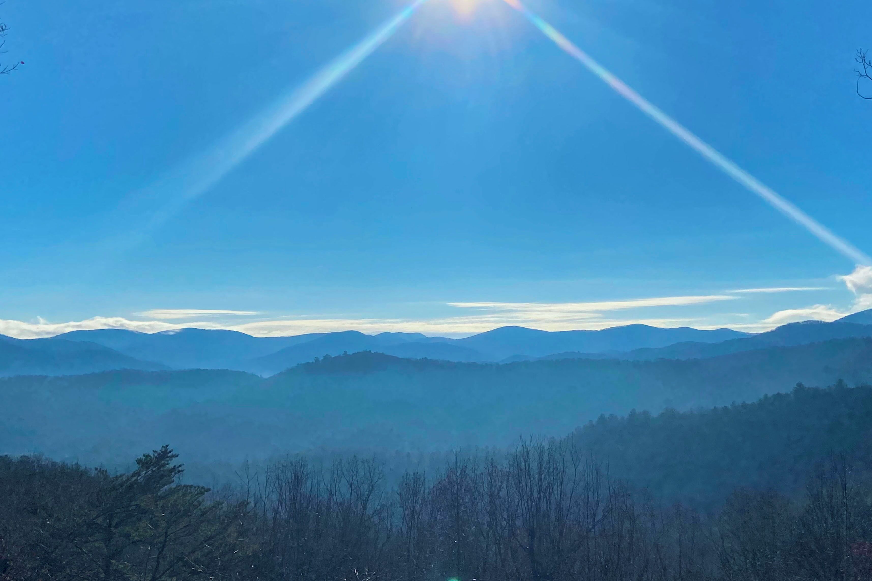 A mountain landscape with clear skies and distant mountains.