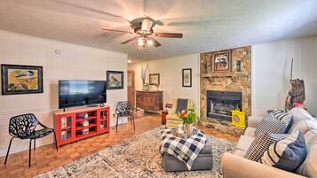 TV, fireplace, books