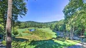 A golf course with a pond, surrounded by trees and hills. - Sky Valley Retreat w/ Resort Amenities & Views! (Dillard)