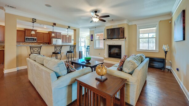A spacious living room with a sofa set, a wooden coffee table, and a television. - Spacious Kathleen Vacation Rental w/ Fireplace (Kathleen)